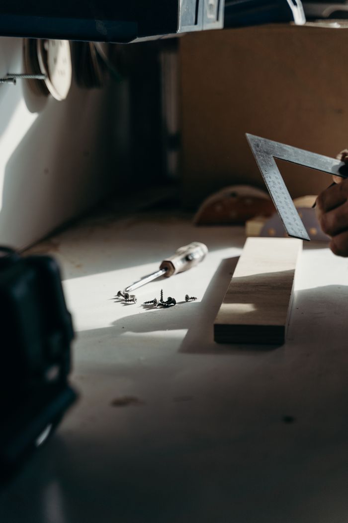 A focused shot of carpentry tools on a workbench, capturing the essence of woodworking.